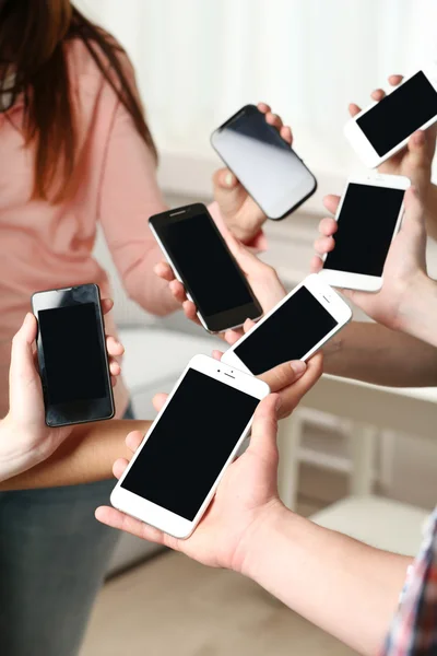 People using smartphones for WhatsApp rent reminders